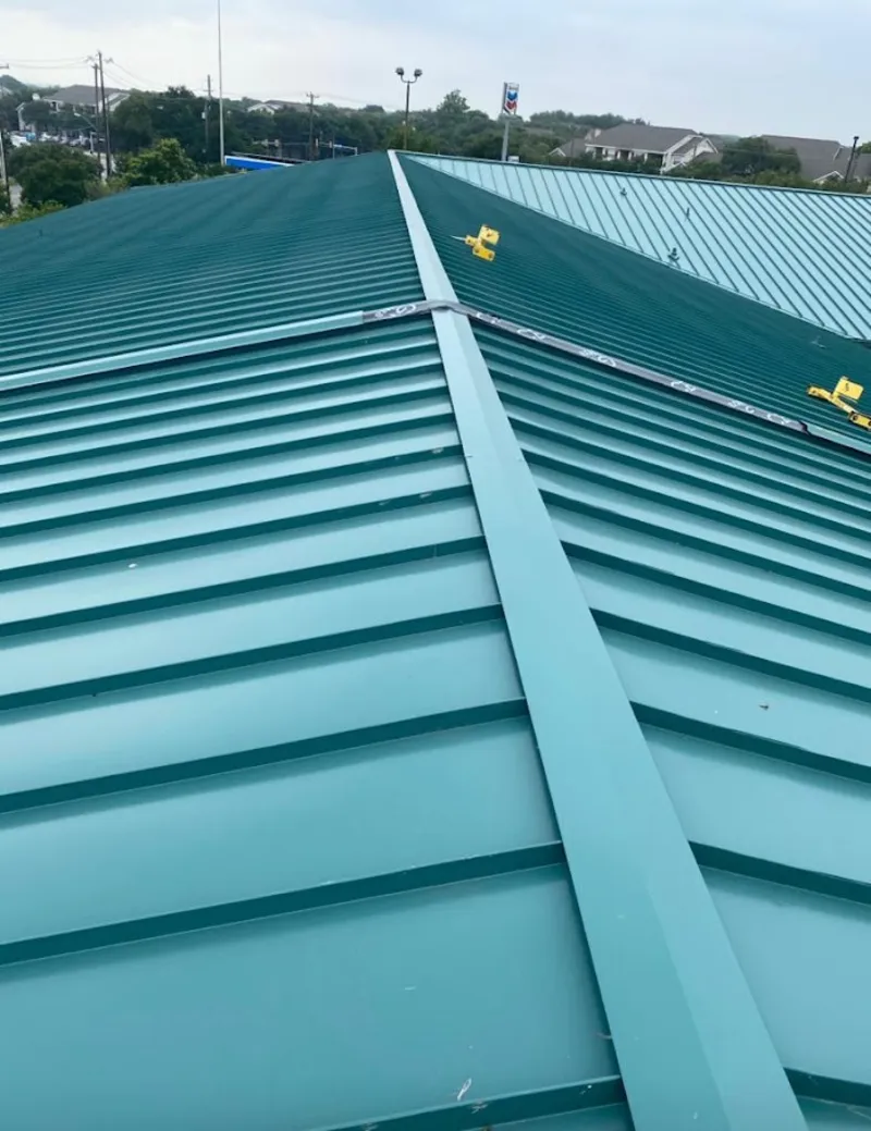 Green commercial metal roof ridge and valley for Metal Roof Repair in Providence Village