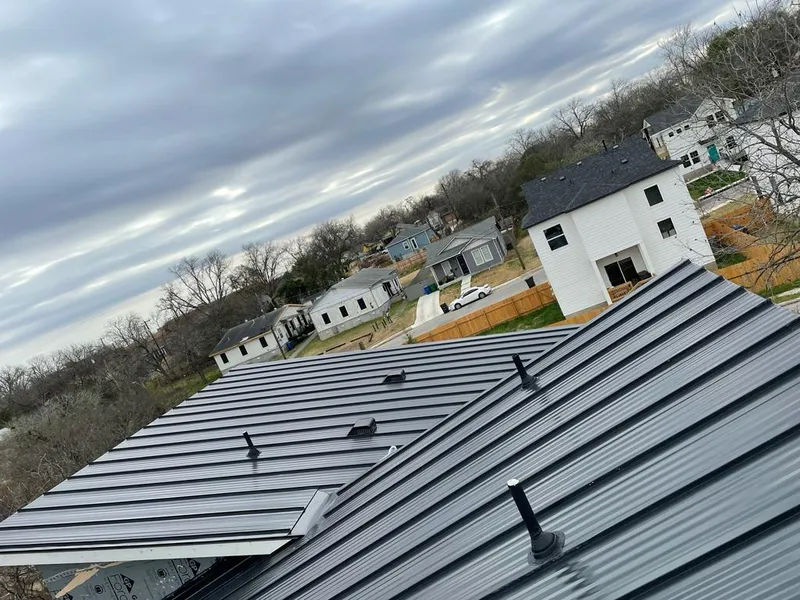 Standing seam metal roof panels with vents for Skylight Repair in Providence Village
